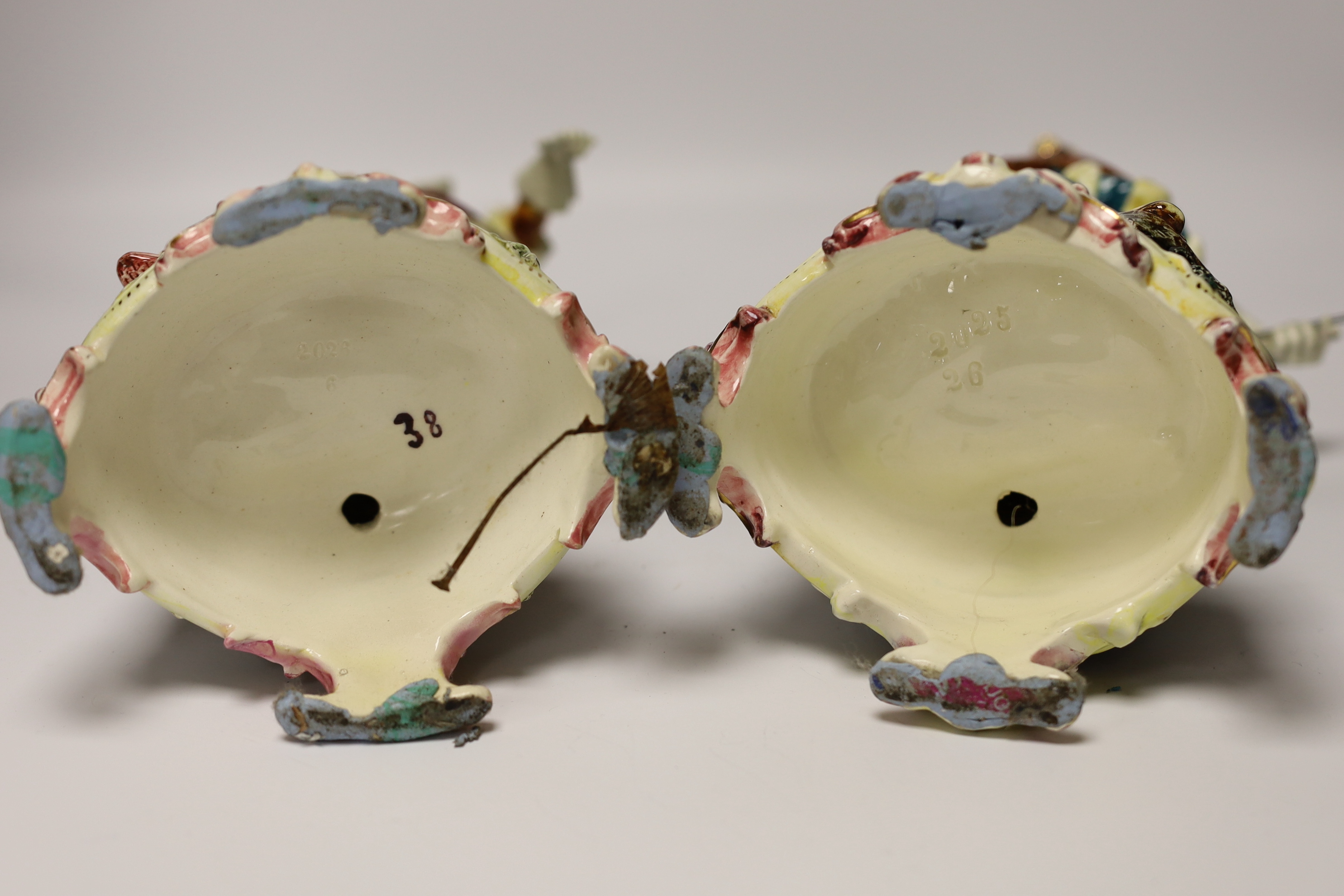 A pair of Volkstedt porcelain figures and a pair continental earthenware figures, 42cm